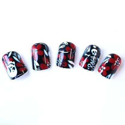 Artificial nail set with creepy skull design and floral accents Acalora