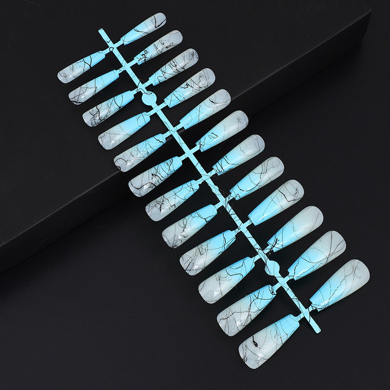 Artificial nails in modern ombre design with marbled accents Acalora