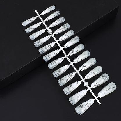 Artificial nails in modern ombre design with marbled accents Acalora