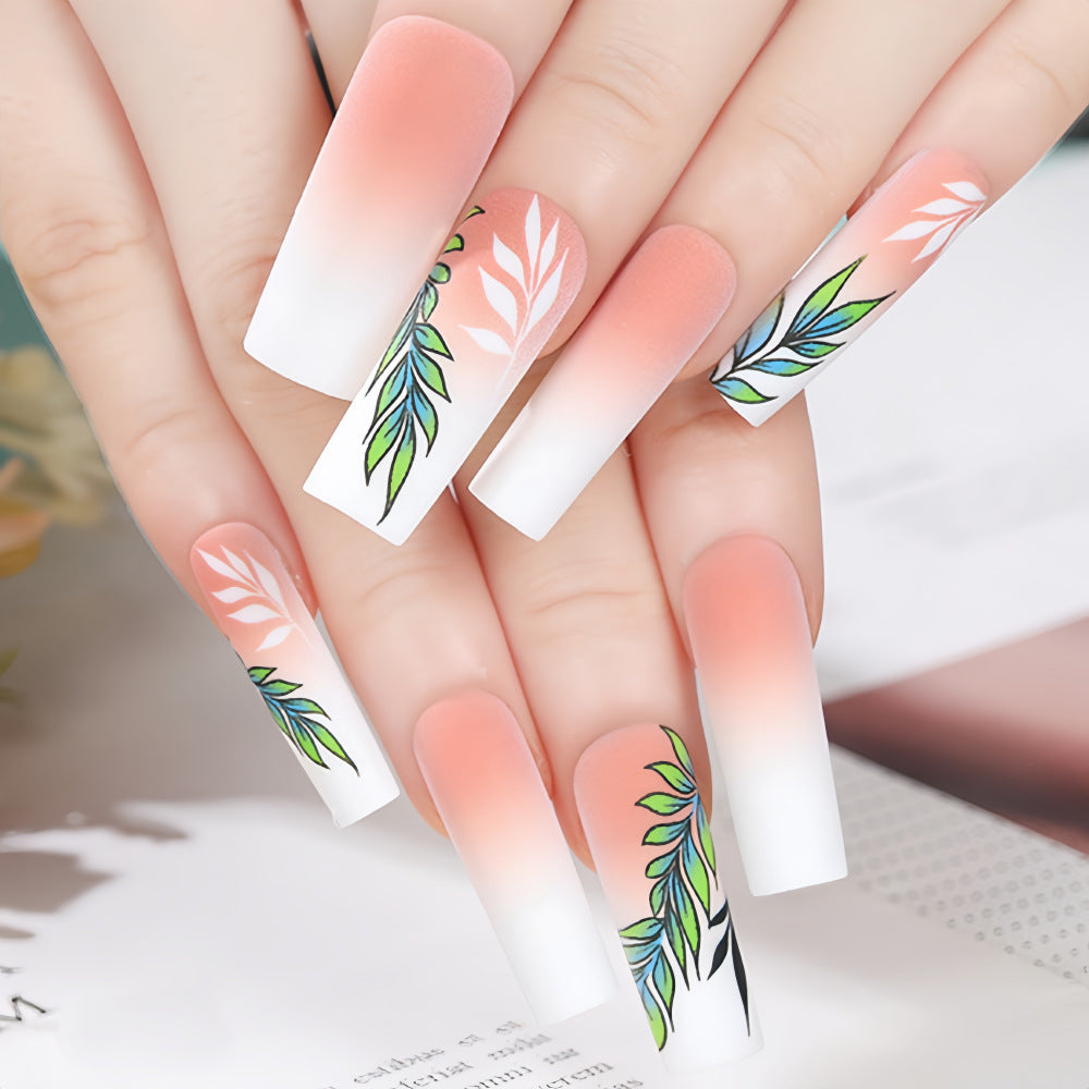 Artificial nails with elegant ombre design and floral accents Acalora