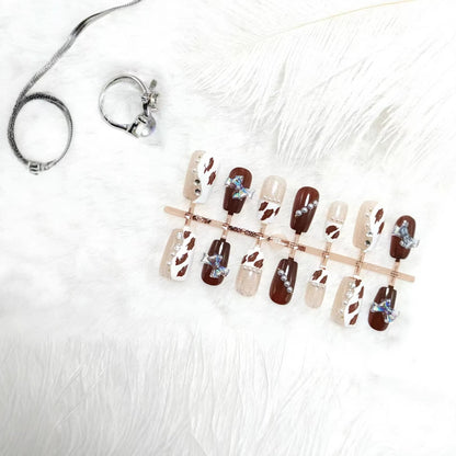 Artificial nails with sparkling rhinestone and bow accents Acalora