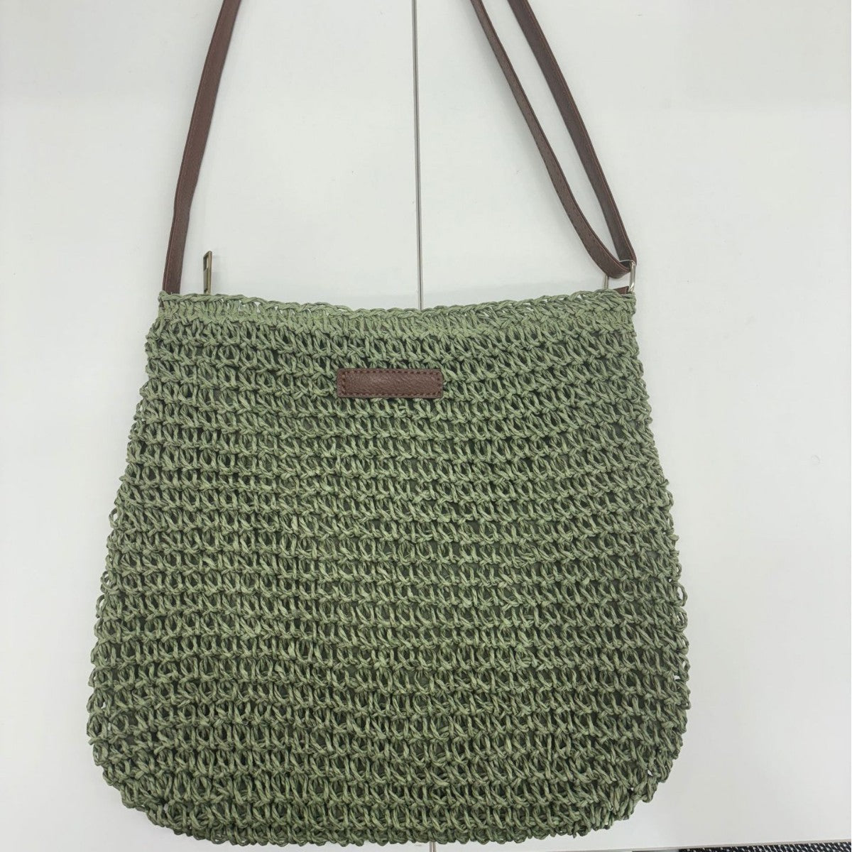 Handwoven shoulder bag with brown leather accent Skanto