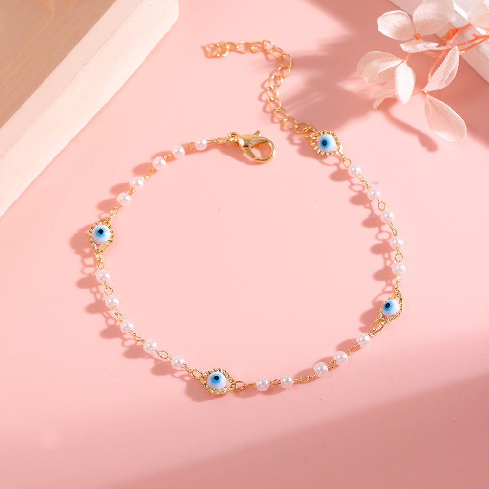 Elegant Pearl and Eye Charm Necklace Acalora