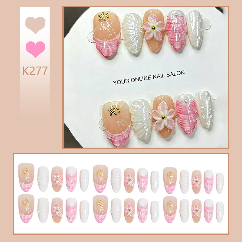 Artificial nail set with floral accents and glitter decorations Acalora