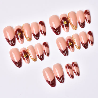 Exclusive artificial nails with floral designs and gold embellishments Acalora