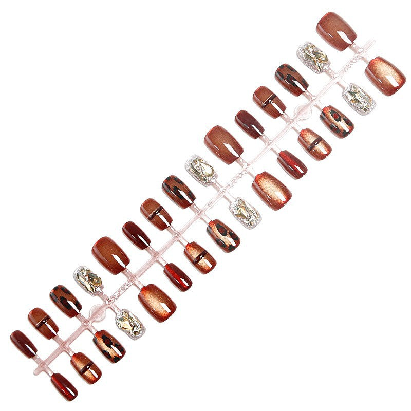Glamorous artificial nails with animal design and glitter accents Acalora