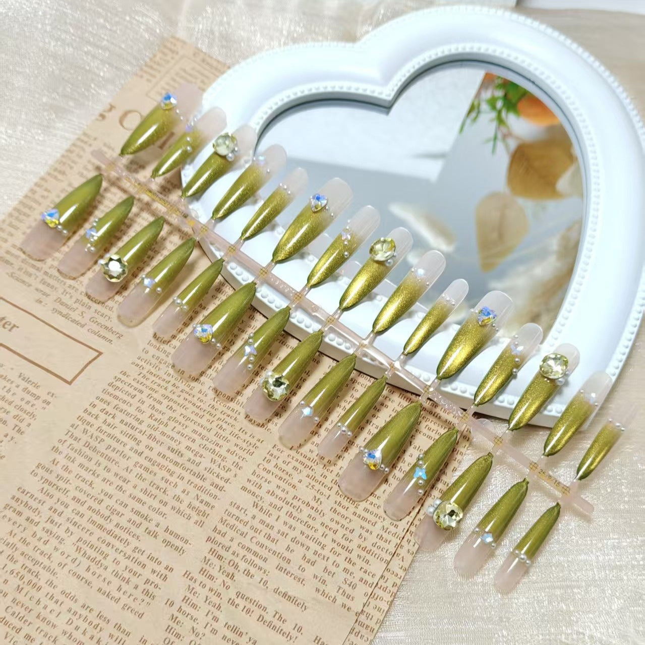 Artificial nail set with glamorous jewelry embellishments Acalora