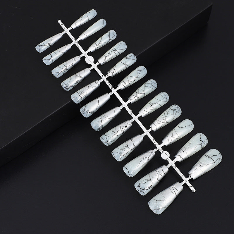 Artificial nails in modern ombre design with marbled accents Acalora