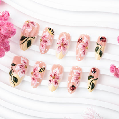 Artificial nail set with floral 3D applications and gloss finish Acalora