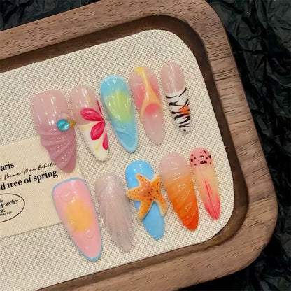 Nail art set with floral patterns and ombre effects Acalora