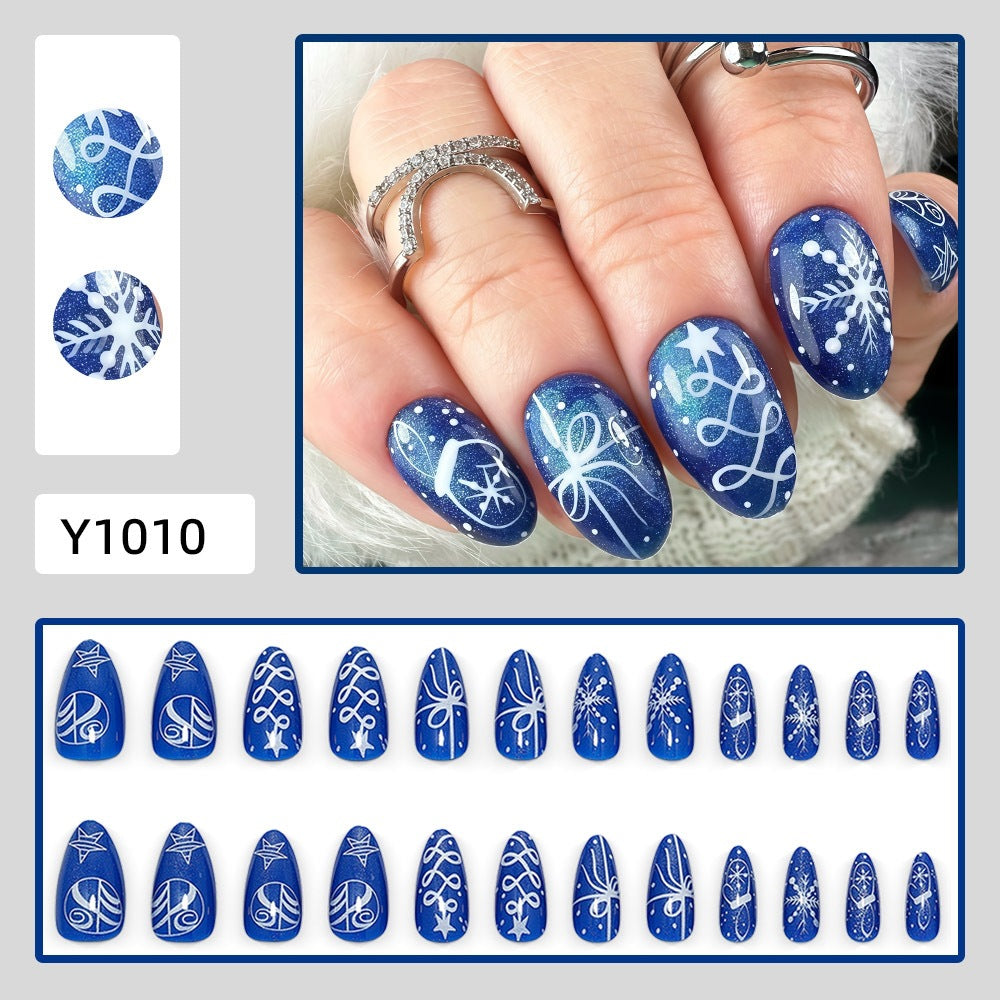 Artificial nails in festive winter design with glittering snowflakes and elegant decorations Acalora