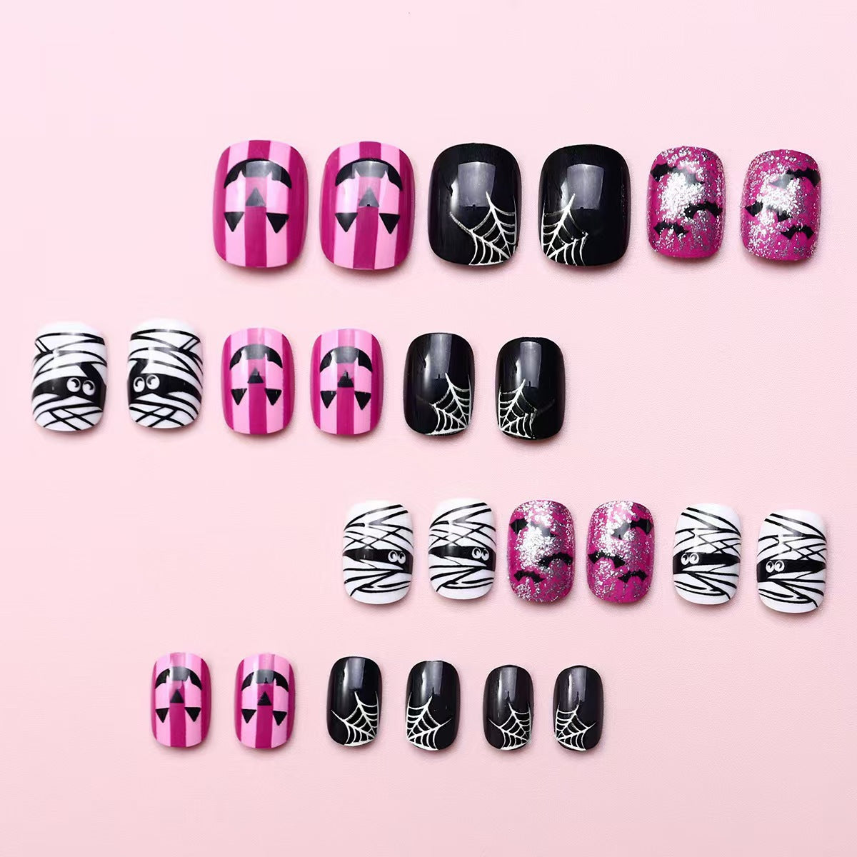 Creative nail art set with Halloween motifs and glitter accents Acalora