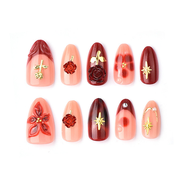 Artificial nail set with elegant floral applications and glamorous accents Acalora
