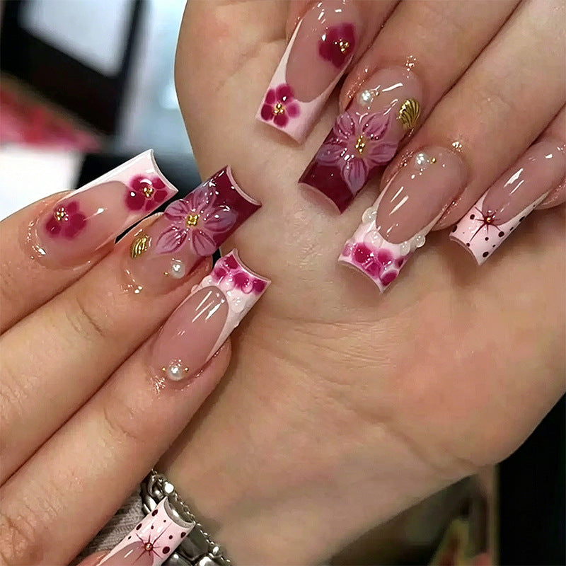 Artificial nail set with floral detail and glitter effects Acalora