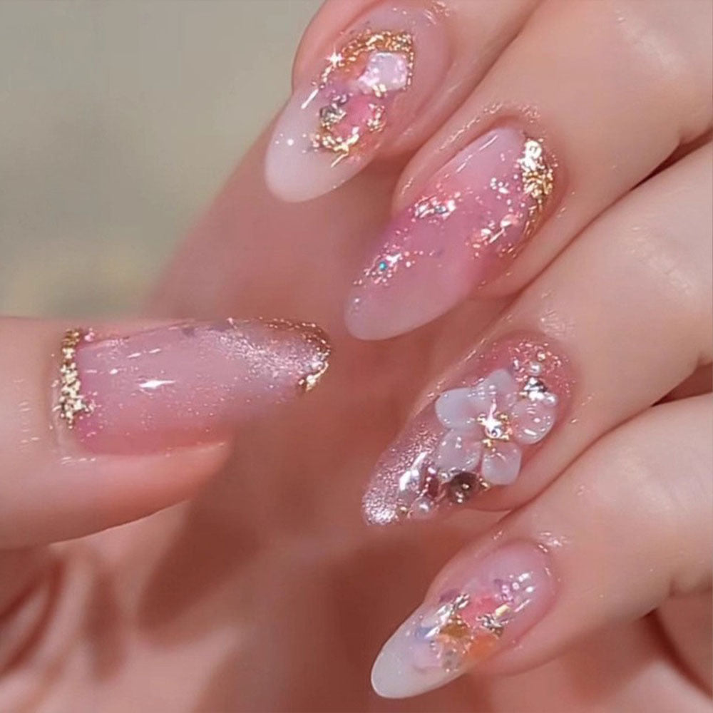 Artificial nails in a playful flower design with glittering accents Acalora