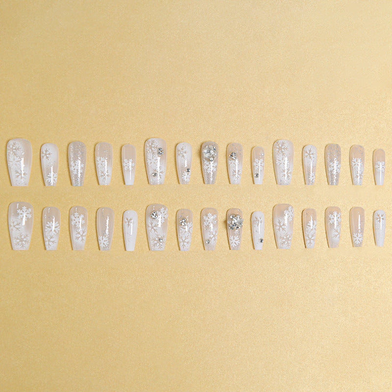 Artificial nail set with frosty snowflake design and sparkling 3D applications Acalora