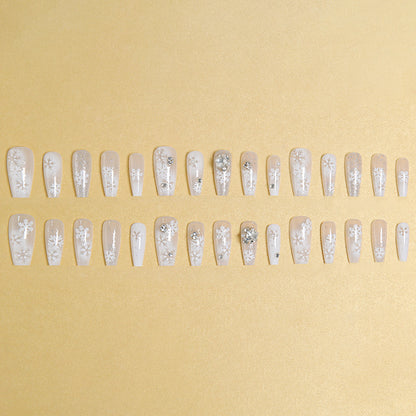 Artificial nail set with frosty snowflake design and sparkling 3D applications Acalora