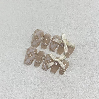 Elegant Press-On Nail Art Set with Ribbons and Gemstone Accents Acalora