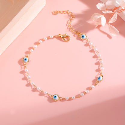 Elegant Pearl and Eye Charm Necklace Acalora