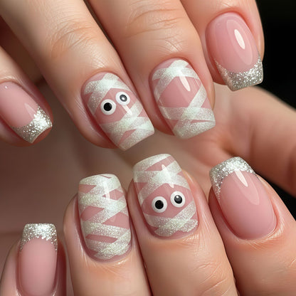 Artificials nails with playful eye design and glitter tips Acalora