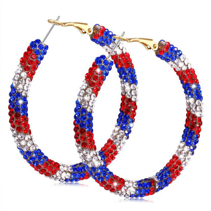 Women's handcrafted crystal pavé hoop earrings with curved tube element and clasp closure Bowlift