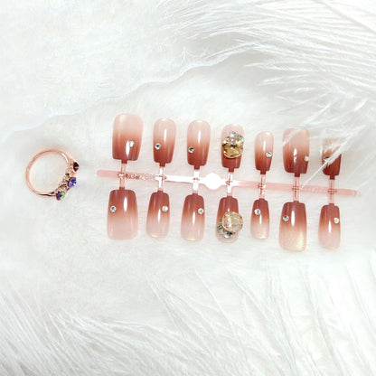 Artificials nails in elegant ombre style with rhinestone embellished applications Acalora