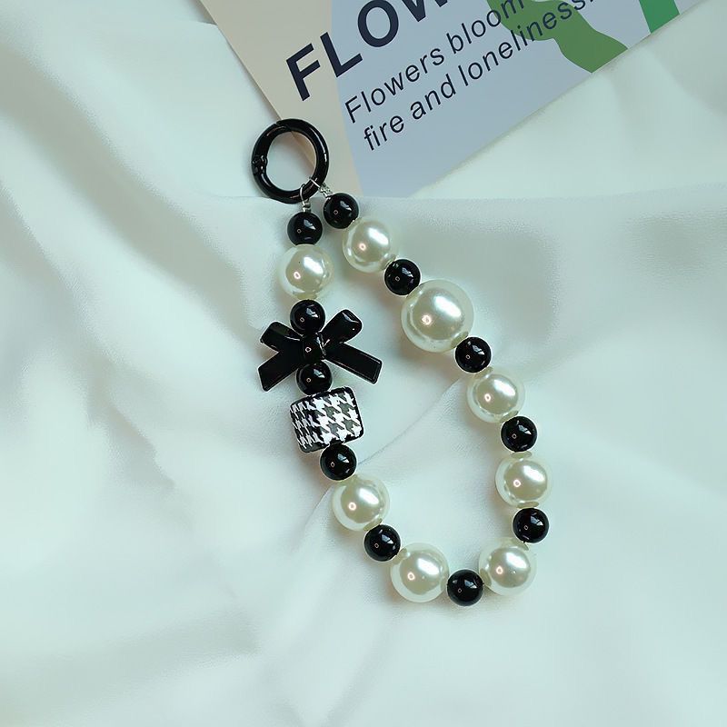 Elegant Pearl and Black Bead Charm Bracelet Acalora