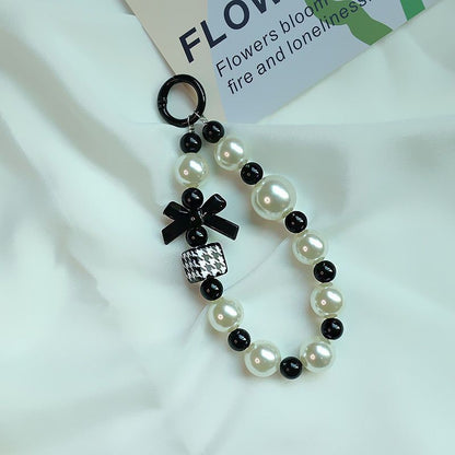 Elegant Pearl and Black Bead Charm Bracelet Acalora