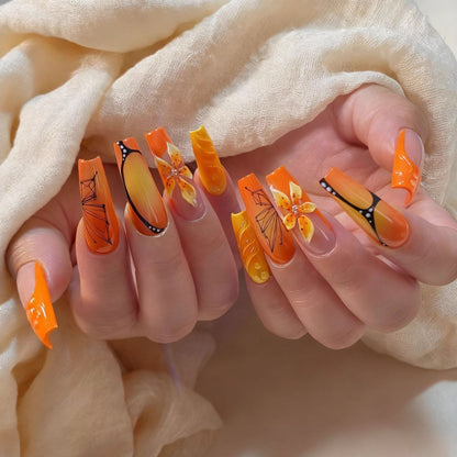Artificial nails with creative flower designs and sparkling accents Acalora