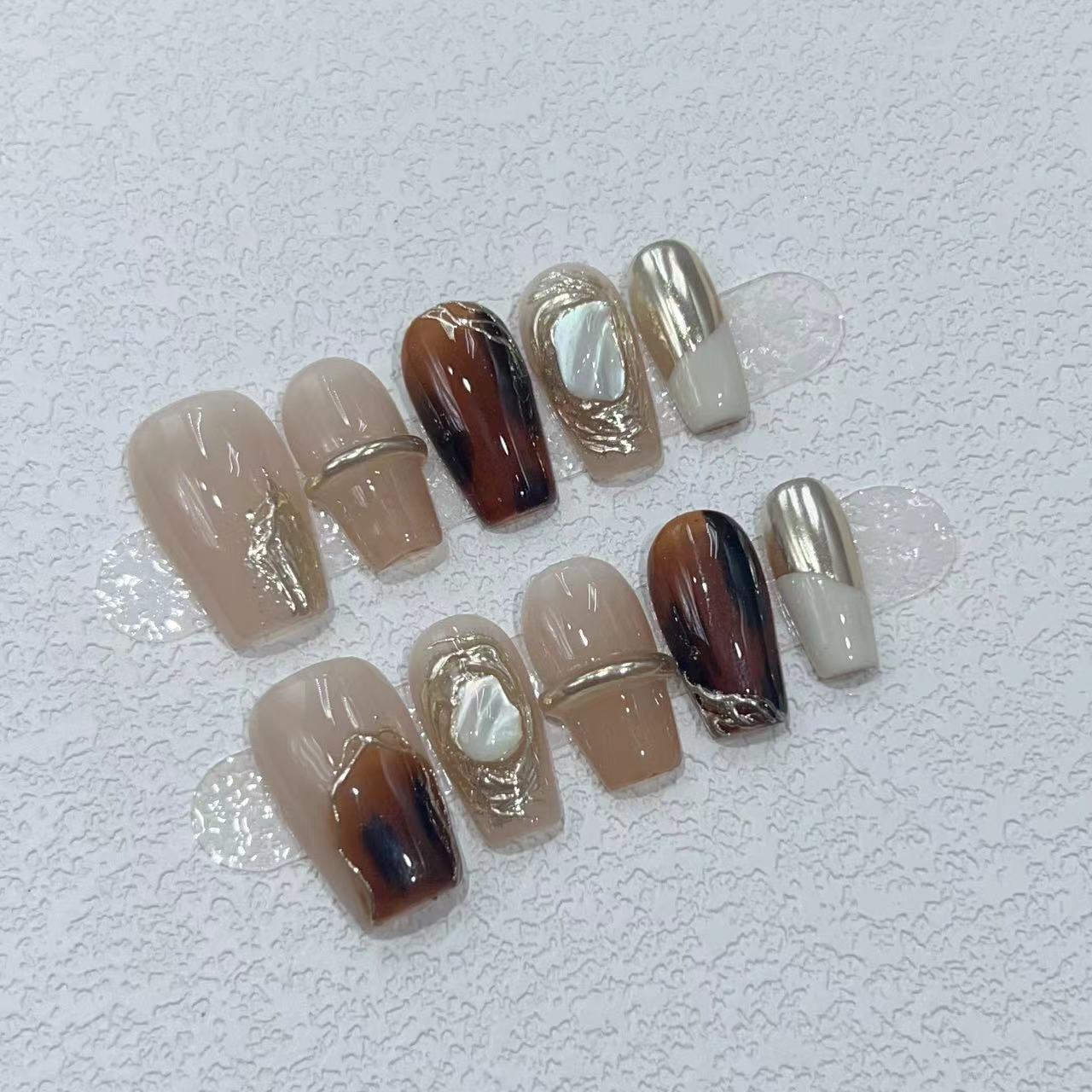 Elegant Nail Art Set with Unique Marble and Metallic Accents Acalora