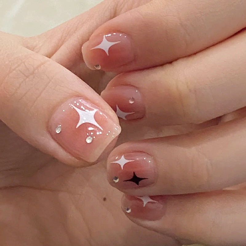 Acrylic nail set with sparkling star decorations and elegant accents Acalora