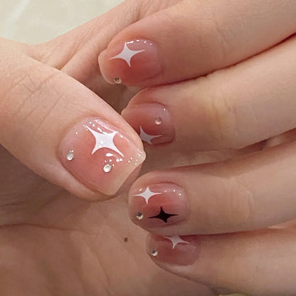 Acrylic nail set with sparkling star decorations and elegant accents Acalora