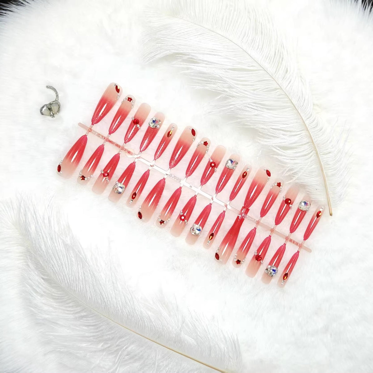 Artificial nails with glamorous glitter and rhinestone embellishments Acalora