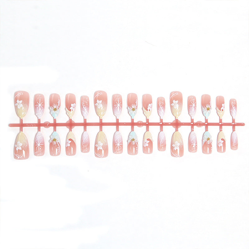 Artificial nail set with intricately detailed floral designs and shine accents Acalora