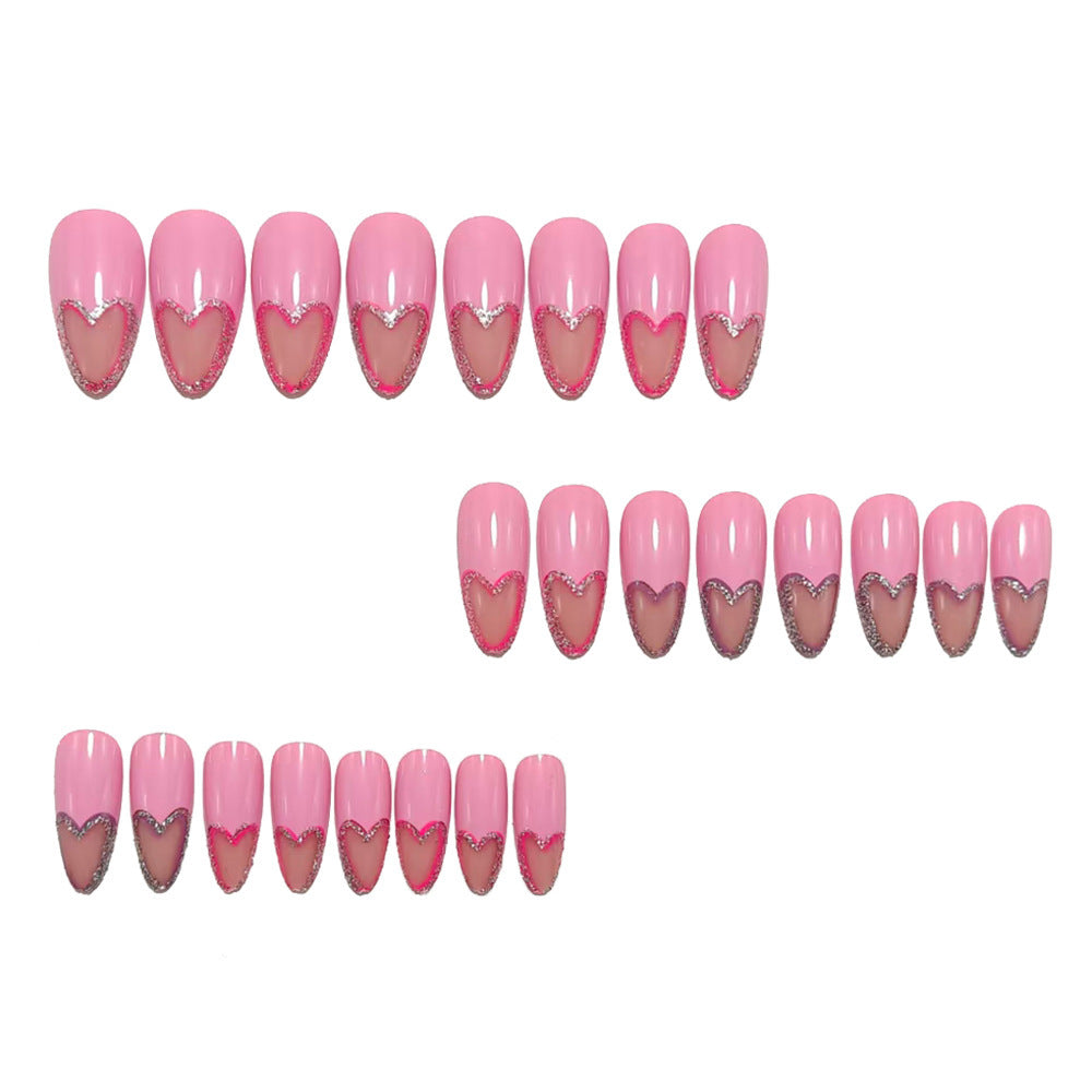 Art nails with heart design and glitter accents Acalora