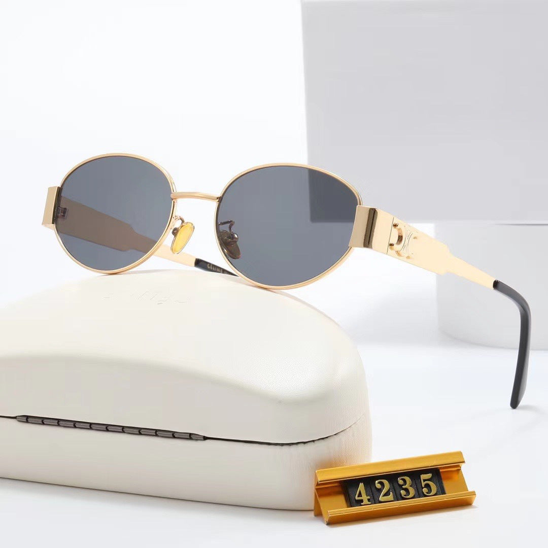 Women's elegant oval sunglasses with gold-colored frame Skanto