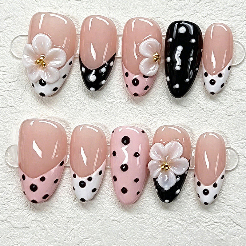 Nail art set with floral accents and elegant dots Acalora