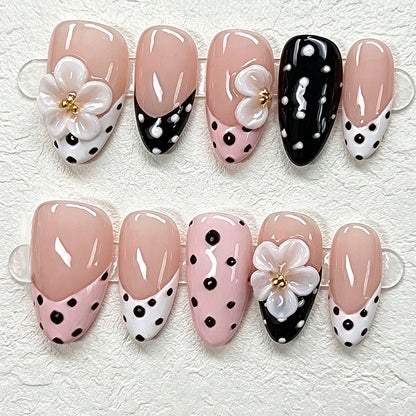 Nail art set with floral accents and elegant dots Acalora