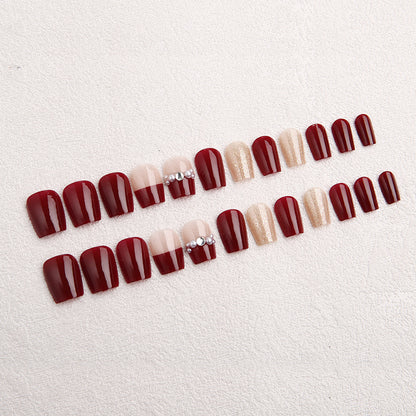 Glamorous artificial nails with glitter and pearl decorations Acalora