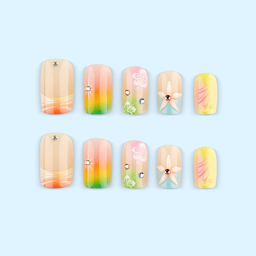 Artificial nails in vibrant floral design with glitter accents Acalora