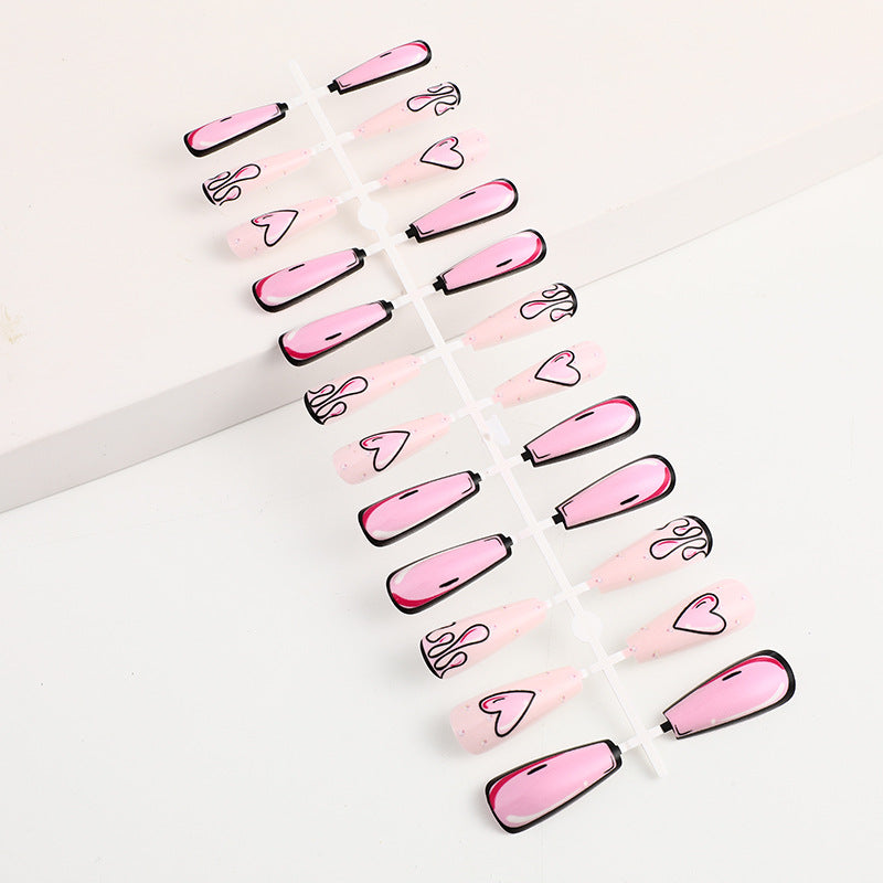 Eye-catching artificial nails with soulful heart design and glamorous accents Acalora
