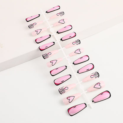 Eye-catching artificial nails with soulful heart design and glamorous accents Acalora