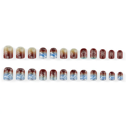 Artificial nails with festive snowflake and gingerbread motif Acalora