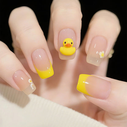Artificial nails with playful duck motif and spring accents Acalora