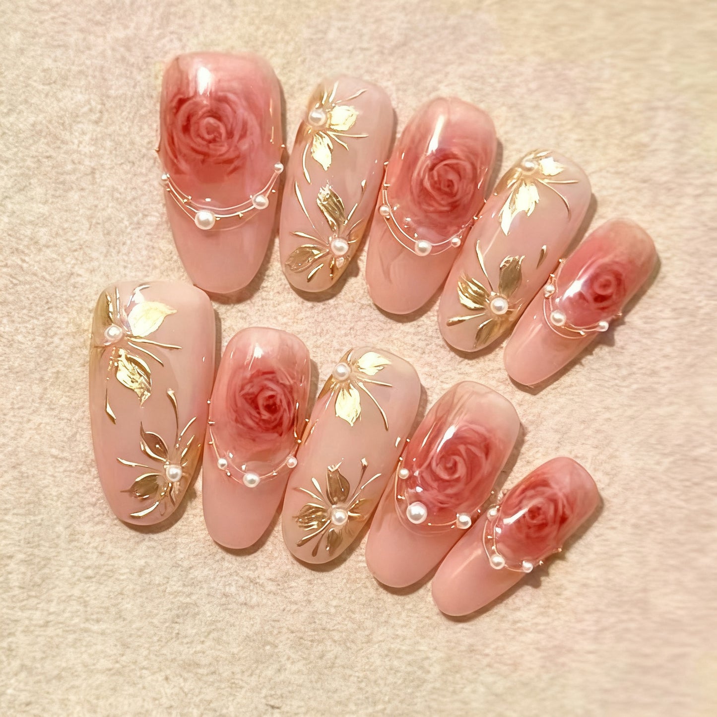 Artificial nail set with glamorous floral designs and creative glitter accents Acalora