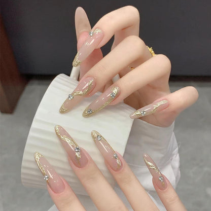 Artificial nail set with elegant gold design and sparkling applications Acalora
