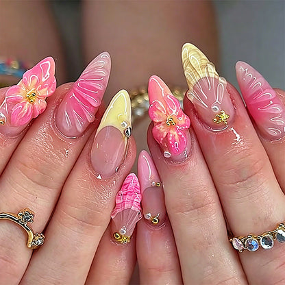 Art nail set with filigree flower decorations and glitter elements Acalora
