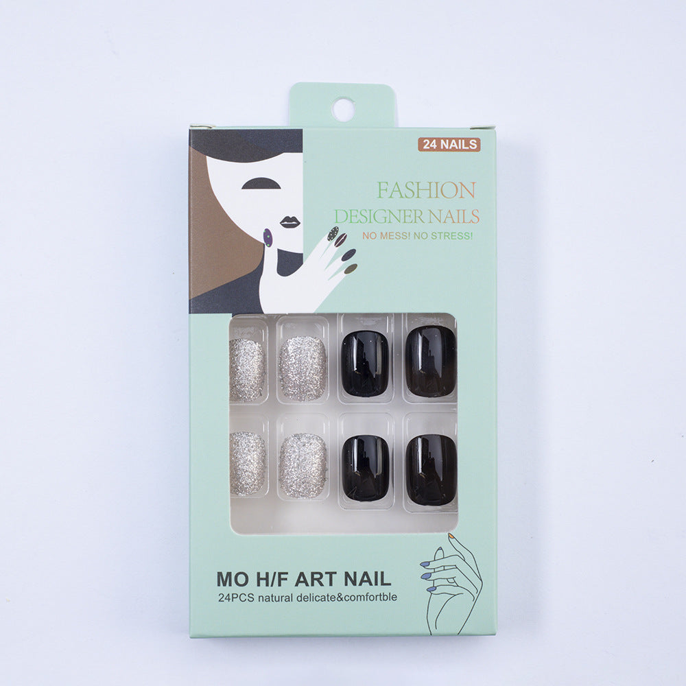 Artificial nails in elegant black with gloss and creative accents Acalora