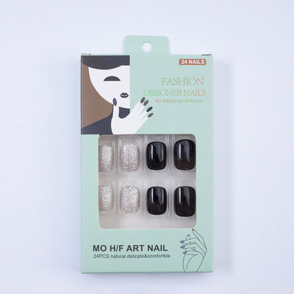 Artificial nails in elegant black with gloss and creative accents Acalora