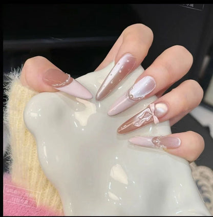 Acrylic nail set with elegant tips and glamorous rhinestone accents Acalora